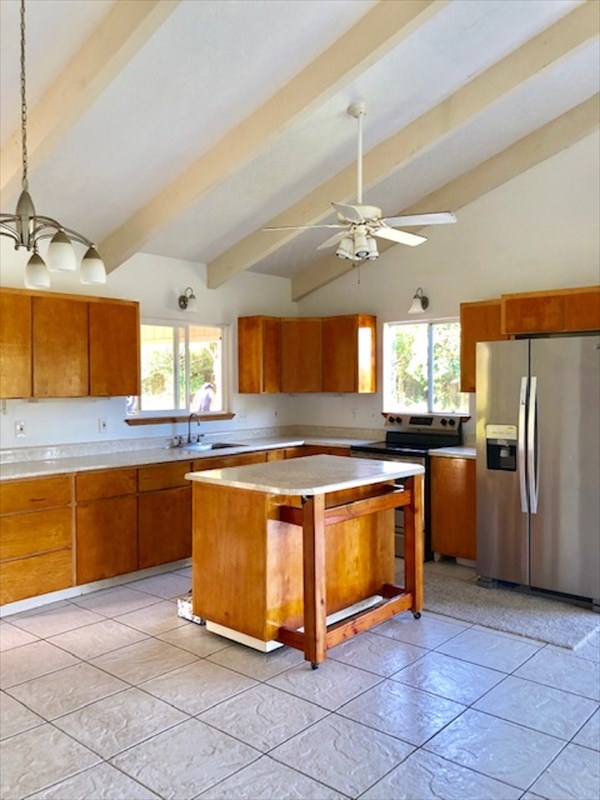 769 Ahuna Road Hilo, HI 96720 - Photo 7 of 21 a large kitchen with stainless steel appliances granite countertop a stove a sink dishwasher and a refrigerator