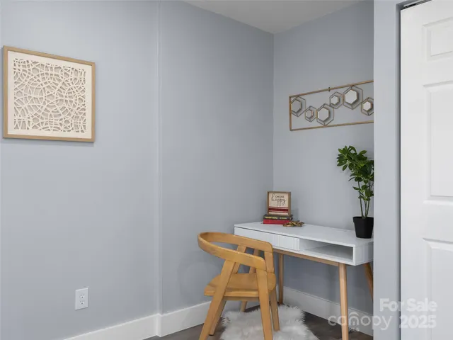 a view of a workspace with furniture