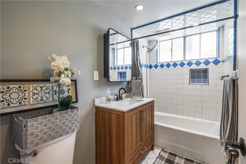 a bathroom with a sink a bathtub and a shower