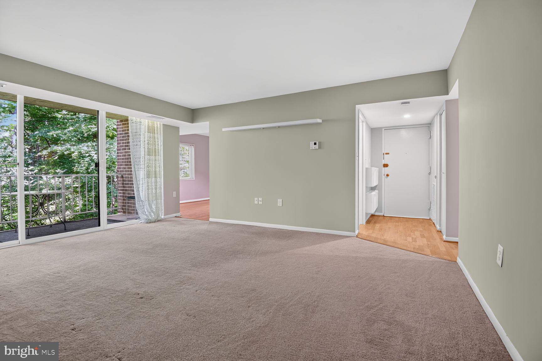 1534 Northgate Square, Unit 11C Reston, VA 20190 - Photo 6 of 37 Spacious living area - natural light facing woods