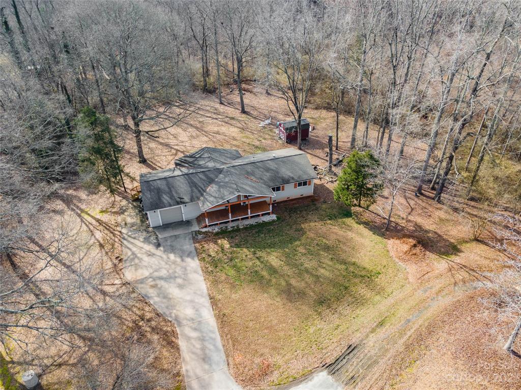 237 Diana Road Cherryville, NC 28021 - Photo 18 of 18 a view of a backyard with large trees