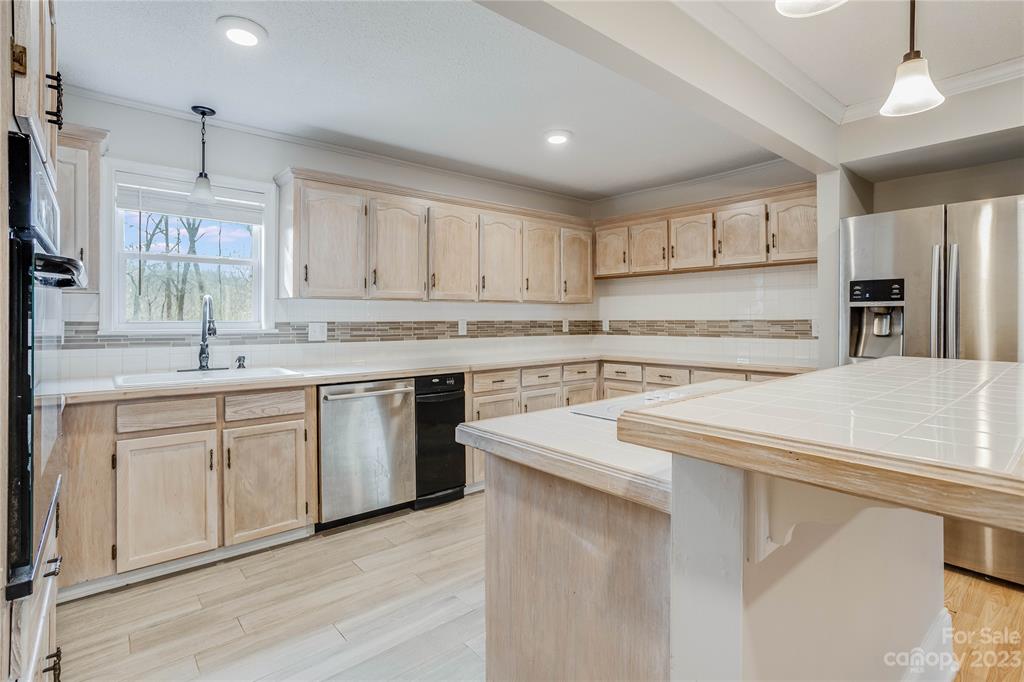 237 Diana Road Cherryville, NC 28021 - Photo 7 of 18 a kitchen with stainless steel appliances cabinets a sink and a stove