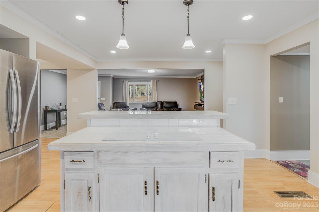 237 Diana Road Cherryville, NC 28021 - Photo 9 of 18 a view of a kitchen with kitchen island a sink stainless steel appliances and cabinets