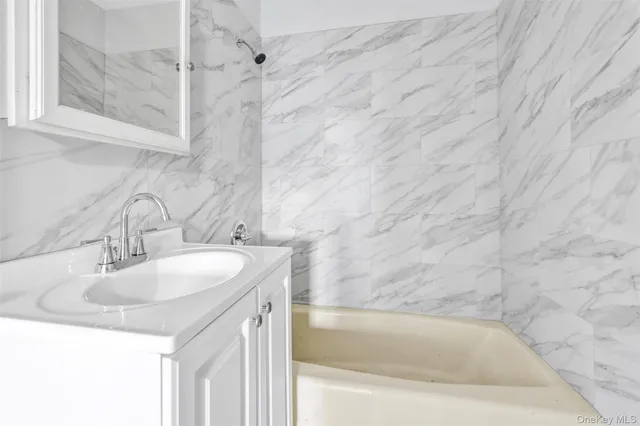 a bathroom with a sink and a bathtub