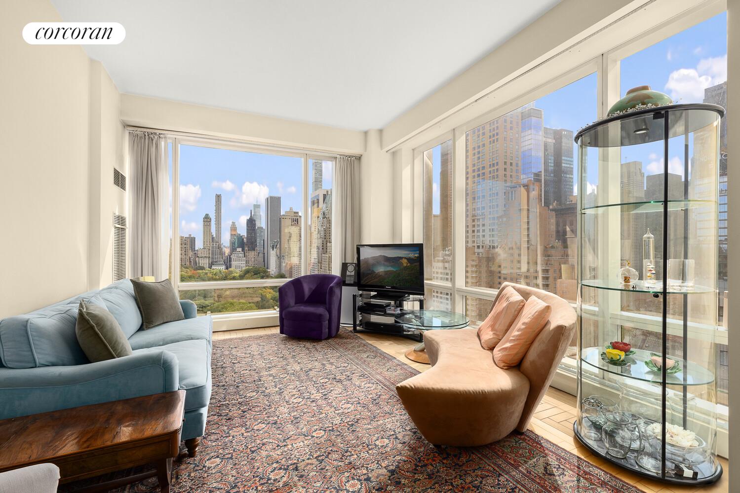 1 Central Park West, Unit 23C Manhattan, NY 10023 - Photo 6 of 10 a living room with furniture and a floor to ceiling window