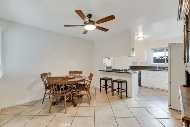 a view of a dining room with furniture and window