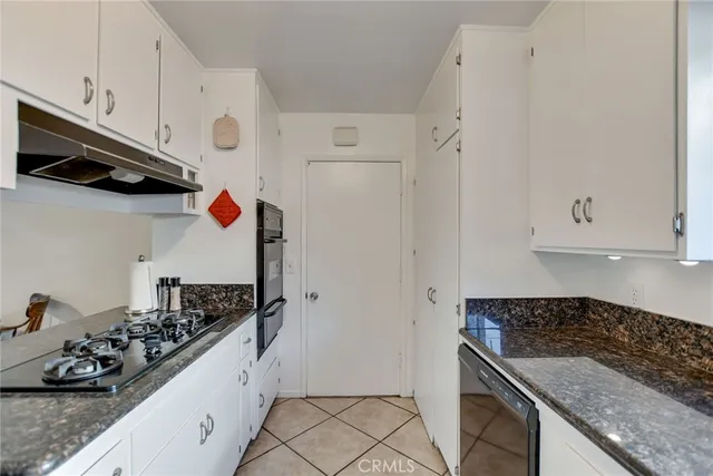 a kitchen with a stove and a microwave