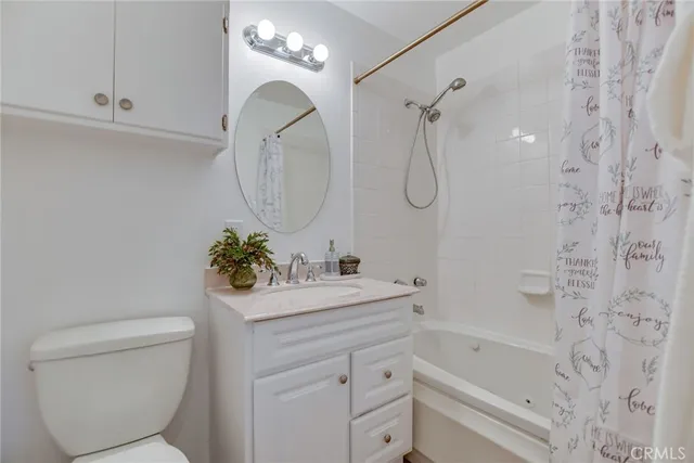 a view of a patio with table and chairs potted plants and a large tree