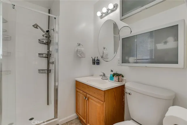 a view of a patio with a table and chairs and potted plants