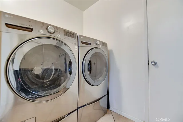 a view of a patio with dining table and chairs with potted plants