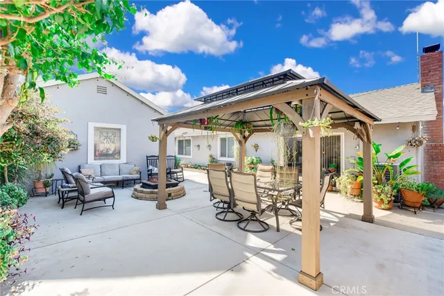 a building outdoor space with patio furniture and potted plants