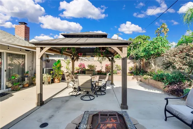 a front view of a house with potted plants