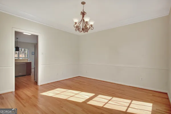 a view of an empty room with glass door