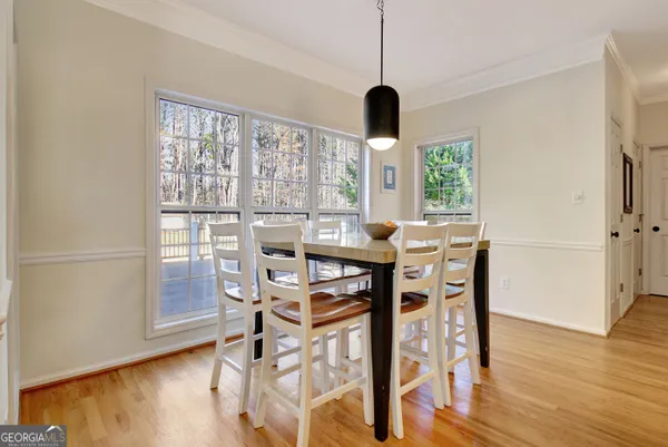 an empty room with ceiling fan and window
