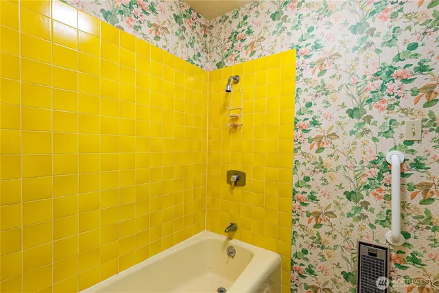 a bathroom with a double vanity sink toilet and a mirror
