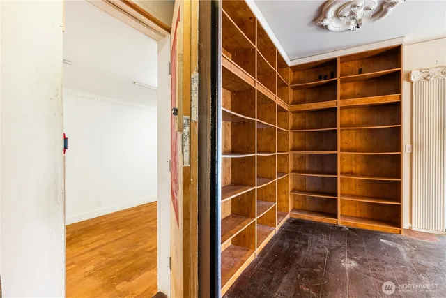 a view of an empty room with a window