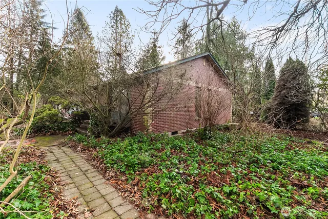 a backyard of a house with lots of green space