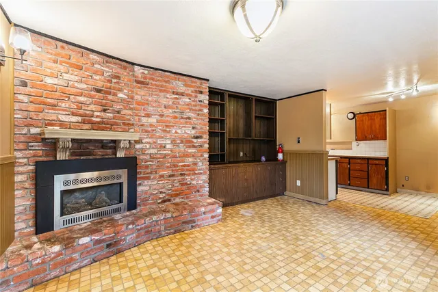 a kitchen with kitchen island a sink stainless steel appliances and cabinets