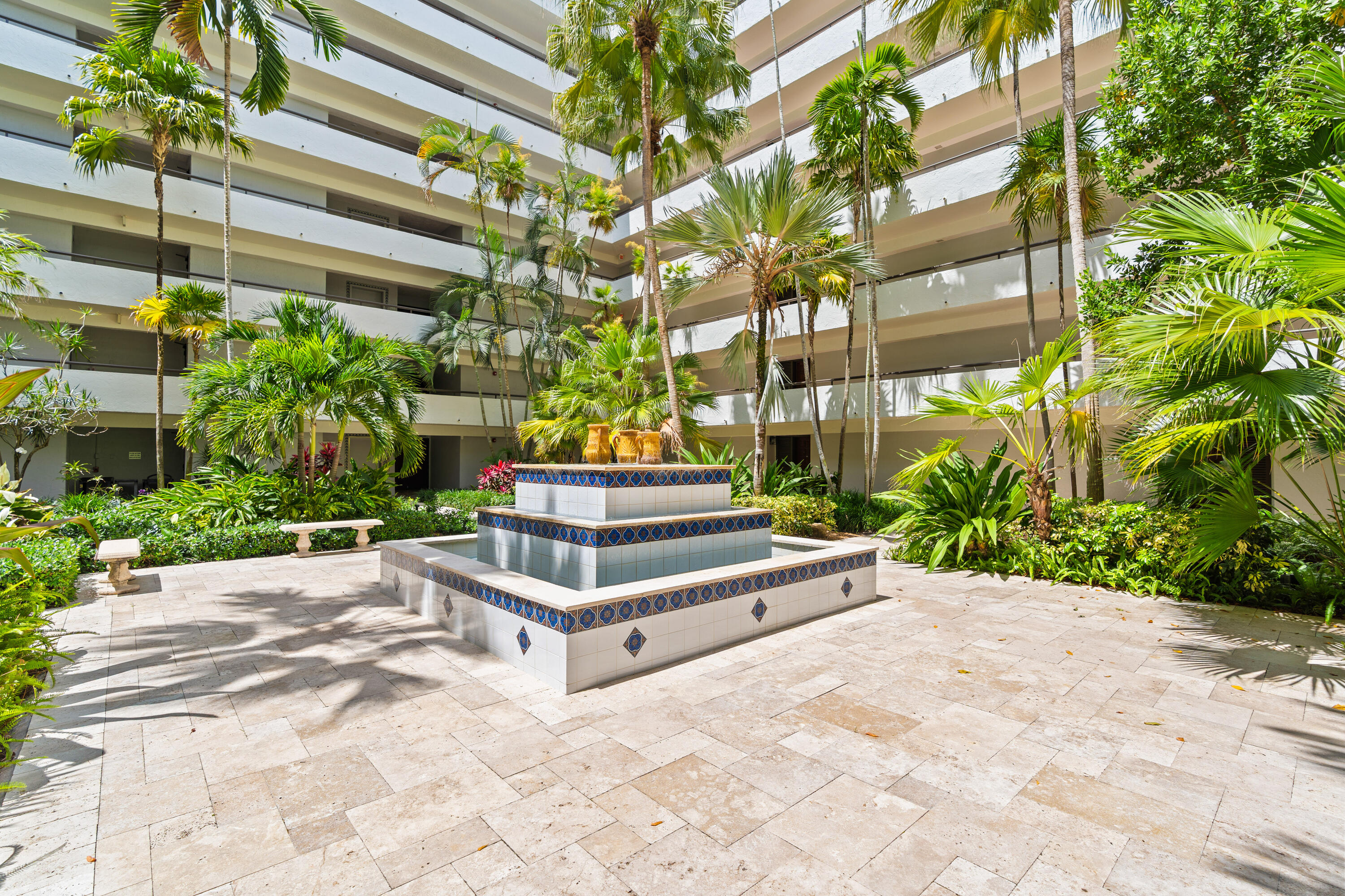 23200 Camino Del Mar, Unit 603 Boca Raton, FL 33433 - Photo 4 of 43 a view of potted plants in front of a building