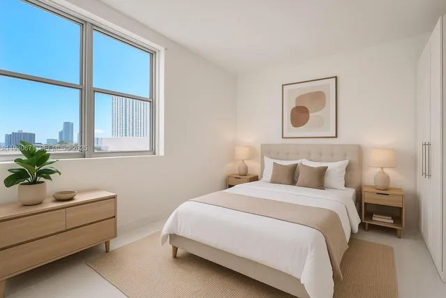 a bedroom with a bed and window