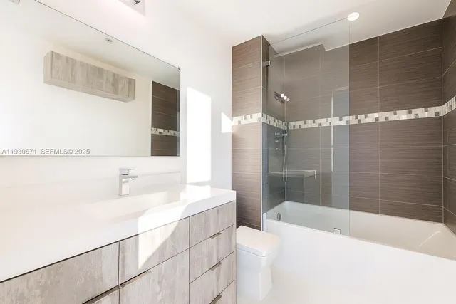 a bathroom with a bathtub and a sink