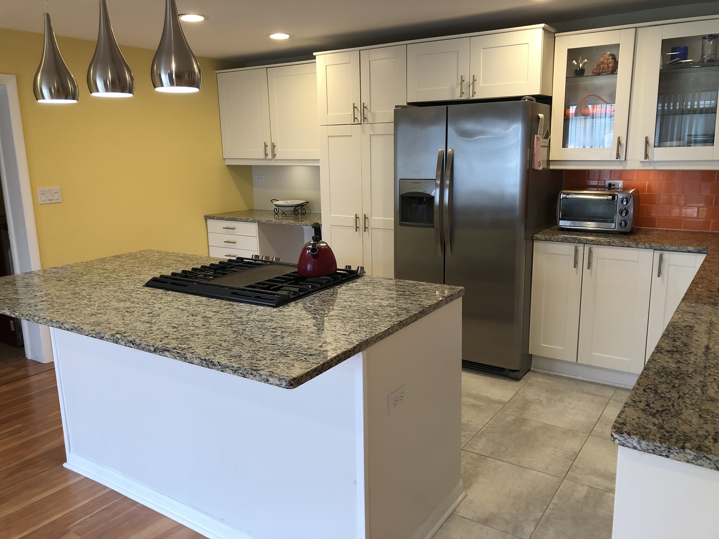 Undisclosed Address Schaumburg, IL 60193 - Photo 5 of 10 a kitchen with stainless steel appliances granite countertop a sink a refrigerator and a stove
