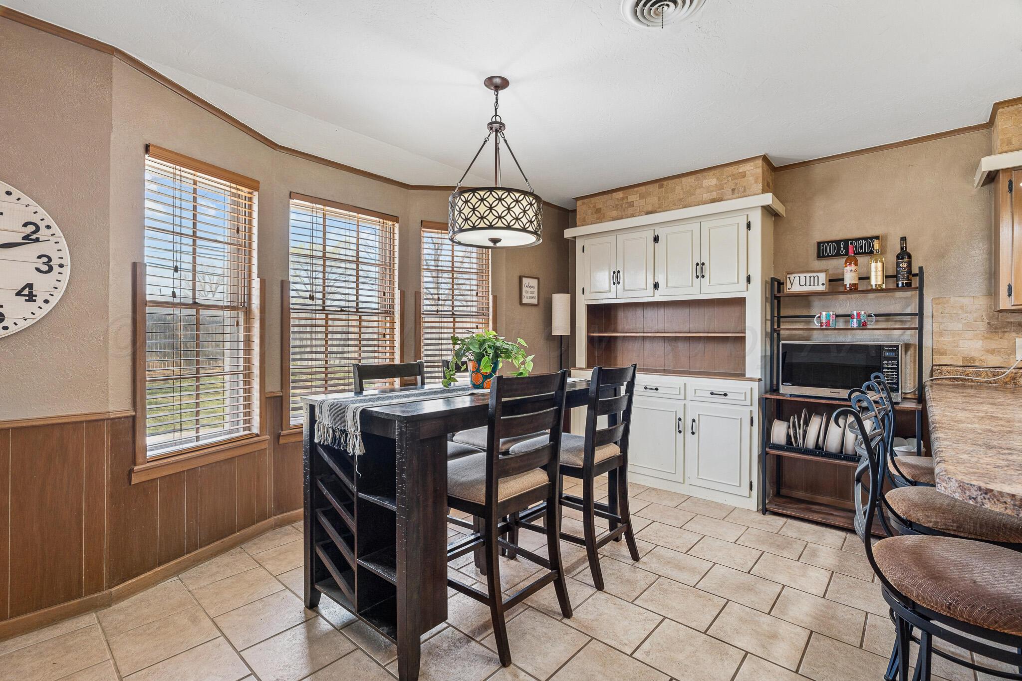 3424 Wayne Street Amarillo, TX 79109 - Photo 12 of 33 a view of a dining room with furniture window and outside view