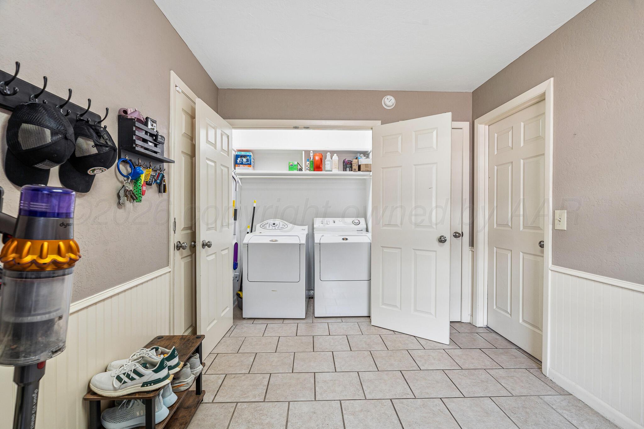 3424 Wayne Street Amarillo, TX 79109 - Photo 17 of 33 a kitchen with a refrigerator and a stove
