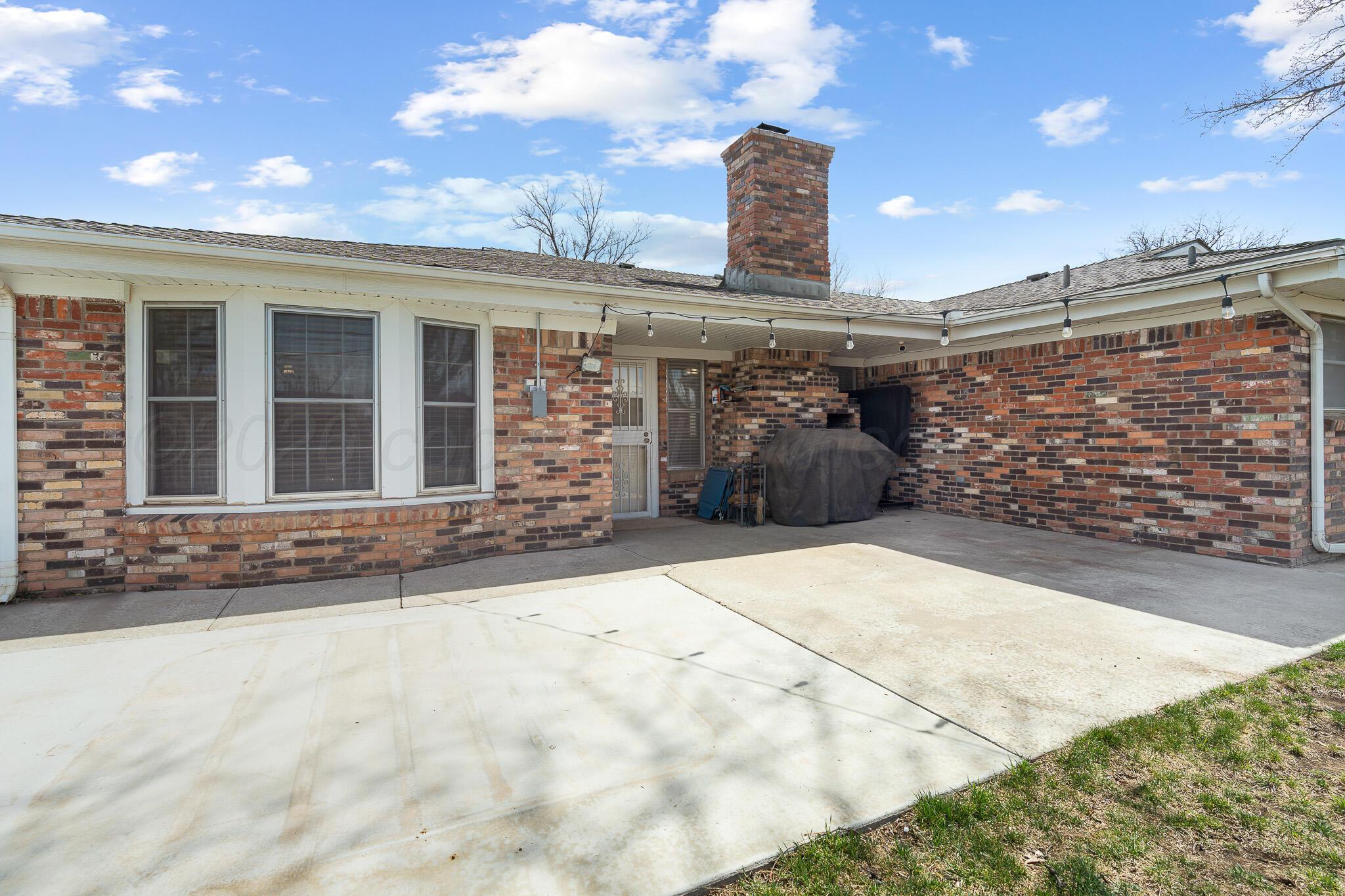 3424 Wayne Street Amarillo, TX 79109 - Photo 30 of 33 a view of a house with a backyard