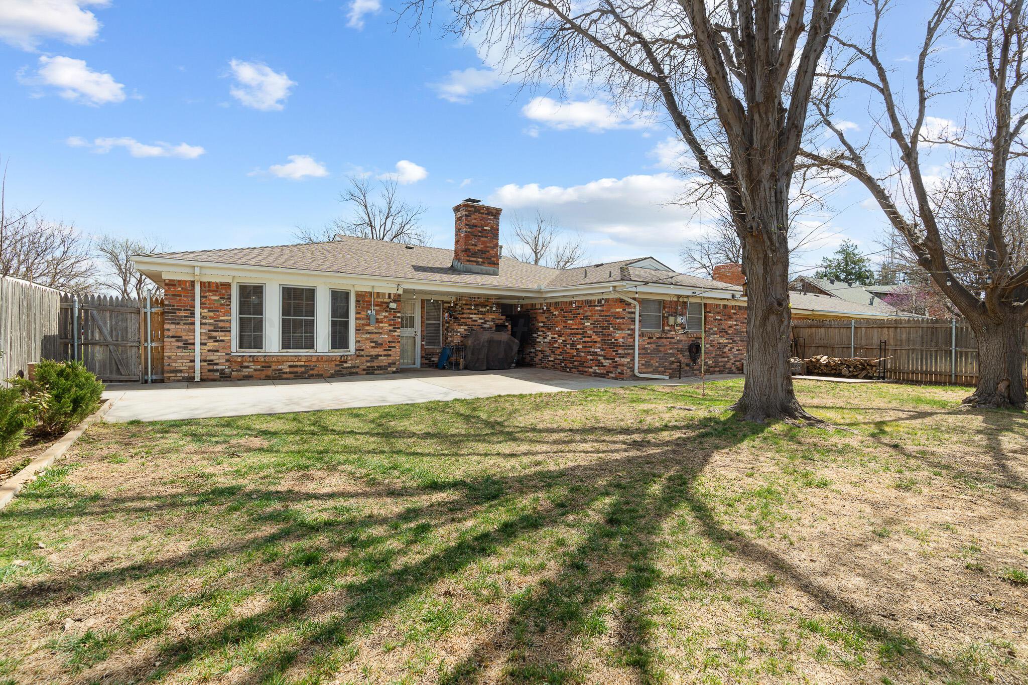 3424 Wayne Street Amarillo, TX 79109 - Photo 32 of 33 a view of a house with a yard and sitting area