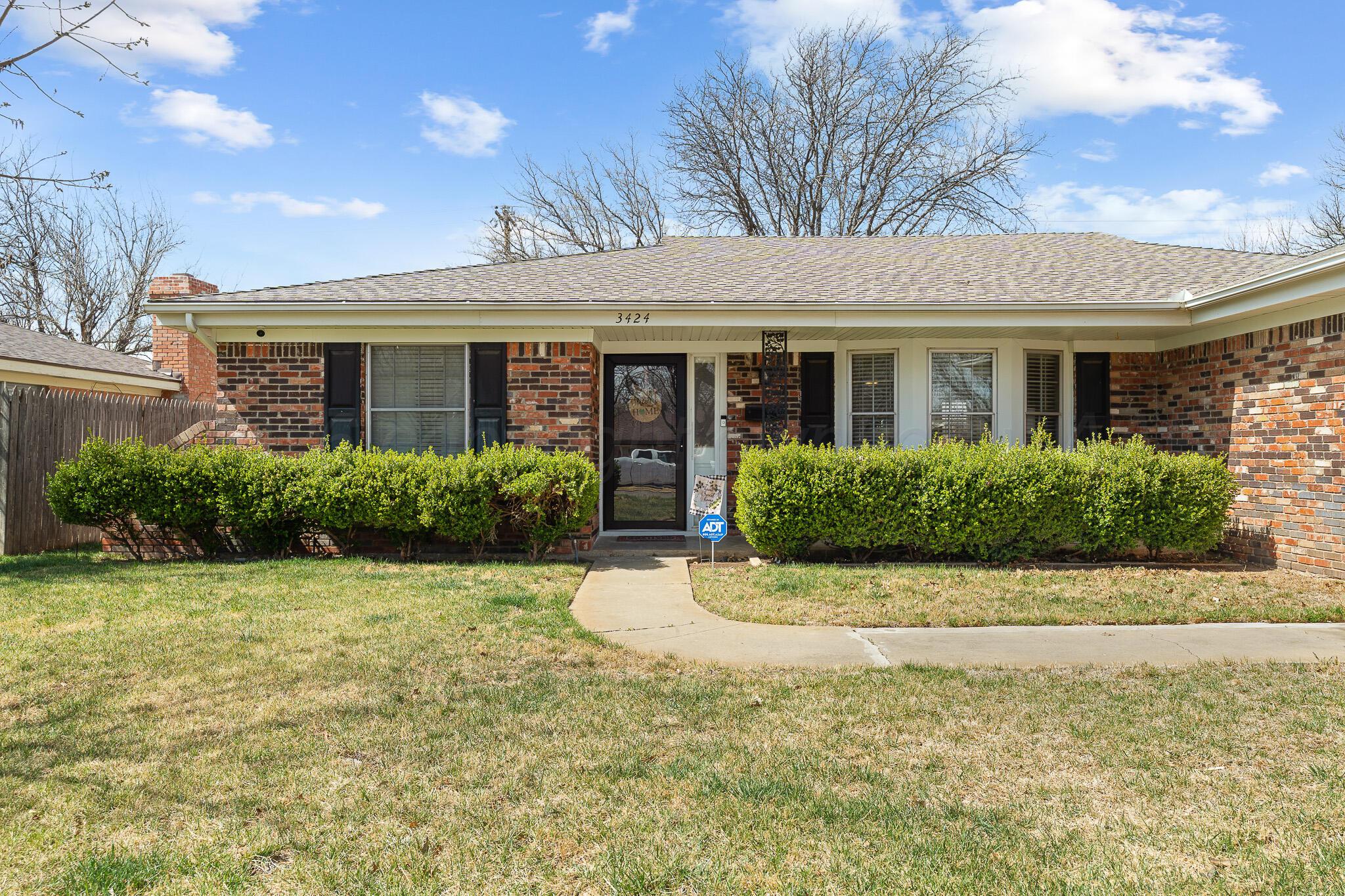 3424 Wayne Street Amarillo, TX 79109 - Photo 5 of 33 a front view of a house with a yard