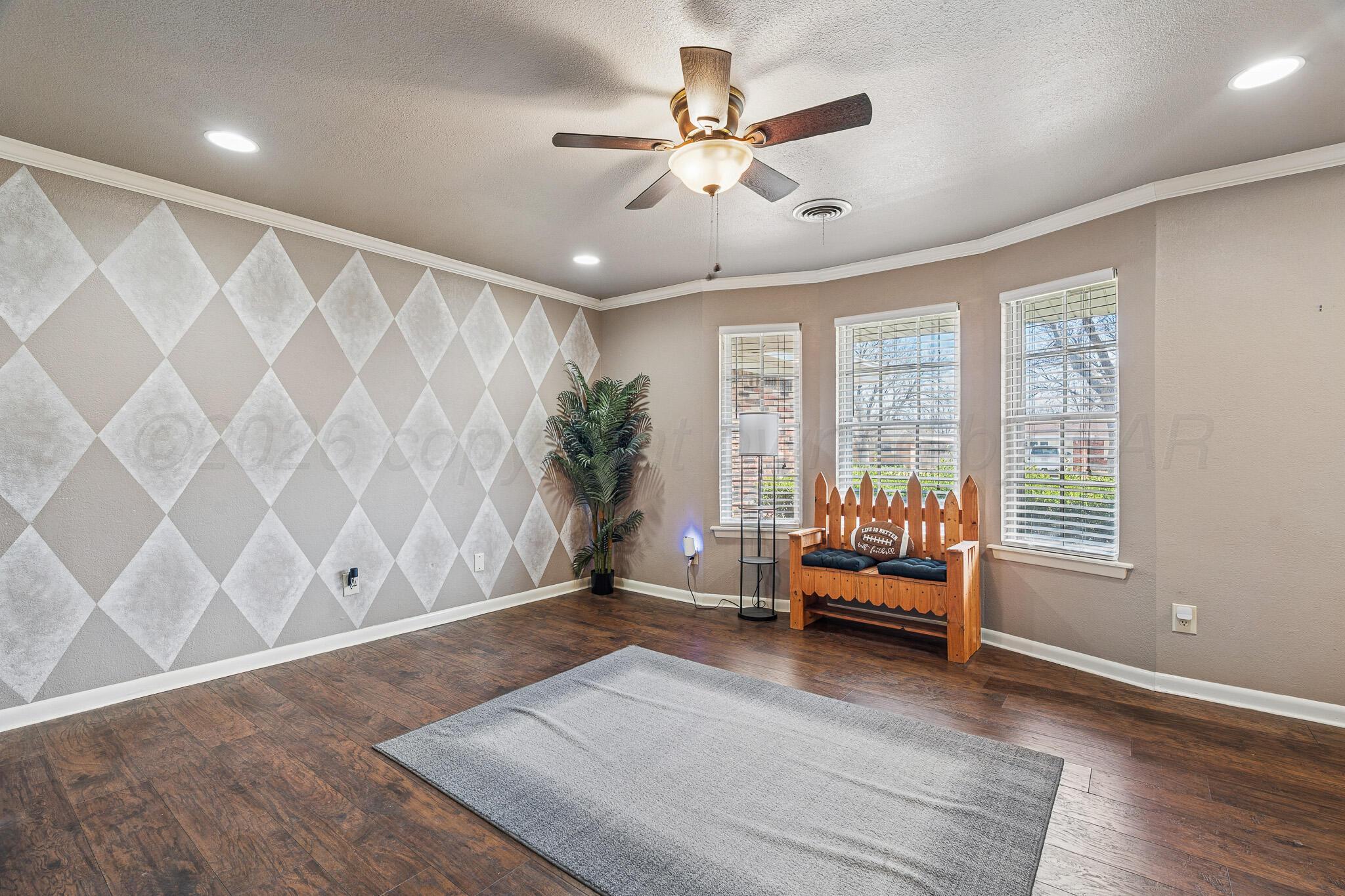 3424 Wayne Street Amarillo, TX 79109 - Photo 8 of 33 a living room with furniture and wooden floor