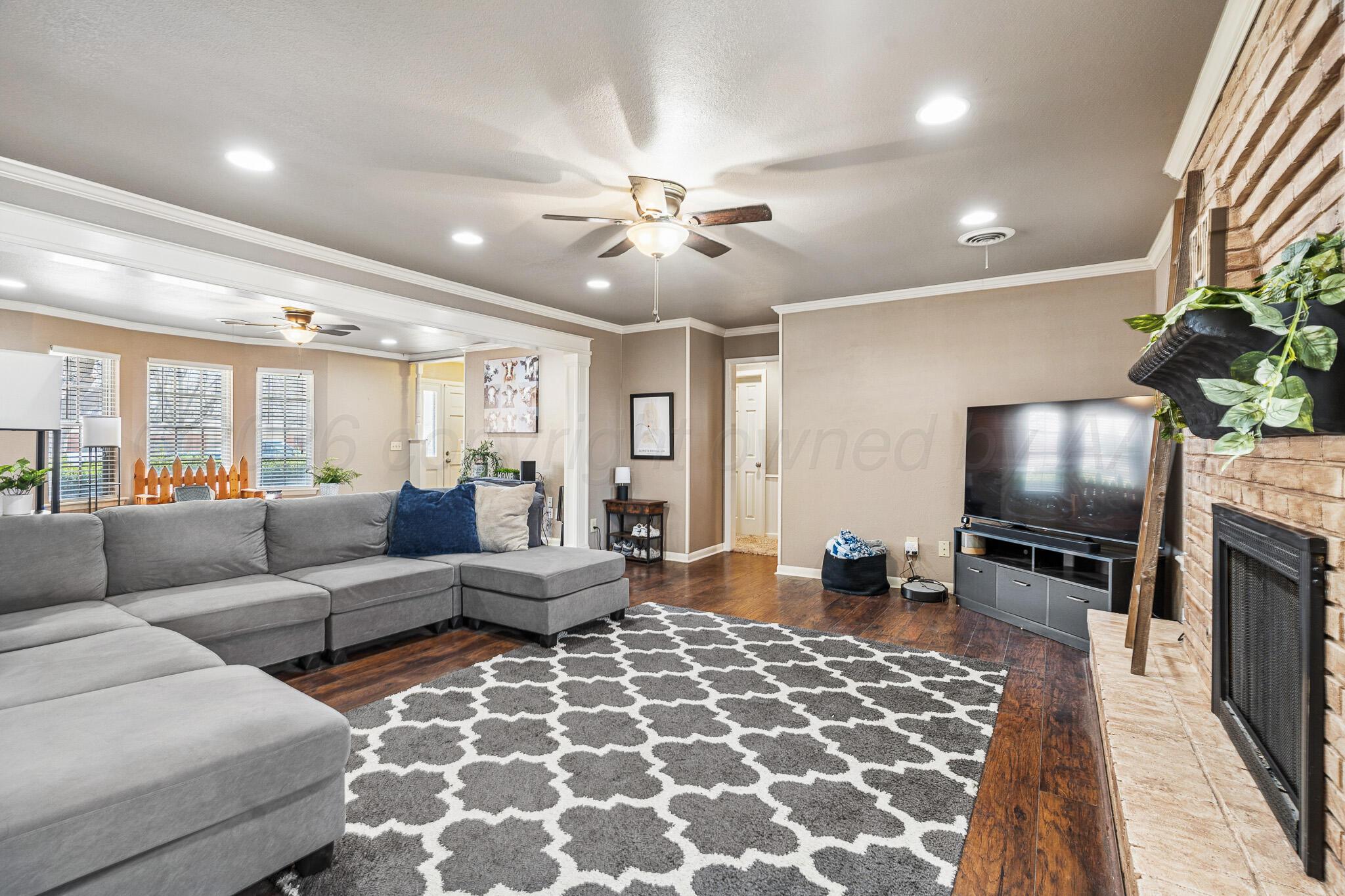 3424 Wayne Street Amarillo, TX 79109 - Photo 9 of 33 a living room with furniture and a flat screen tv