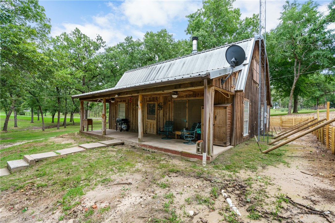 267 Lcr 902 Jewett, TX 75846 - Photo 11 of 37 a view of a house with backyard porch and sitting area
