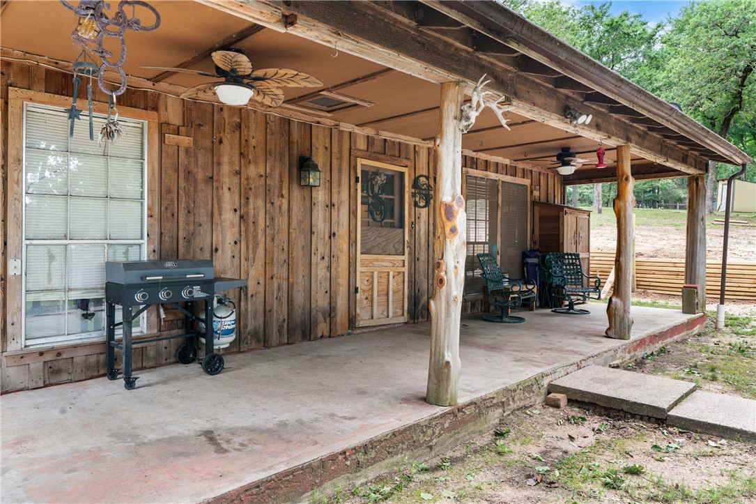 267 Lcr 902 Jewett, TX 75846 - Photo 12 of 37 a view of a porch with chairs and floor