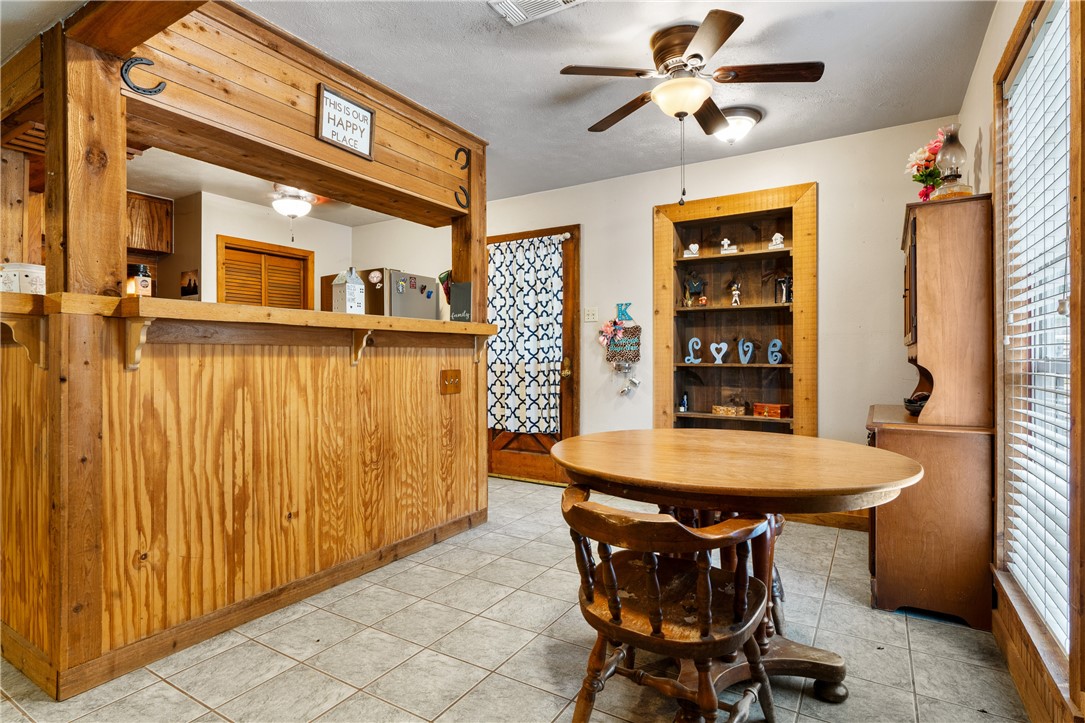 267 Lcr 902 Jewett, TX 75846 - Photo 18 of 37 a view of a dining room with furniture and a chandelier fan