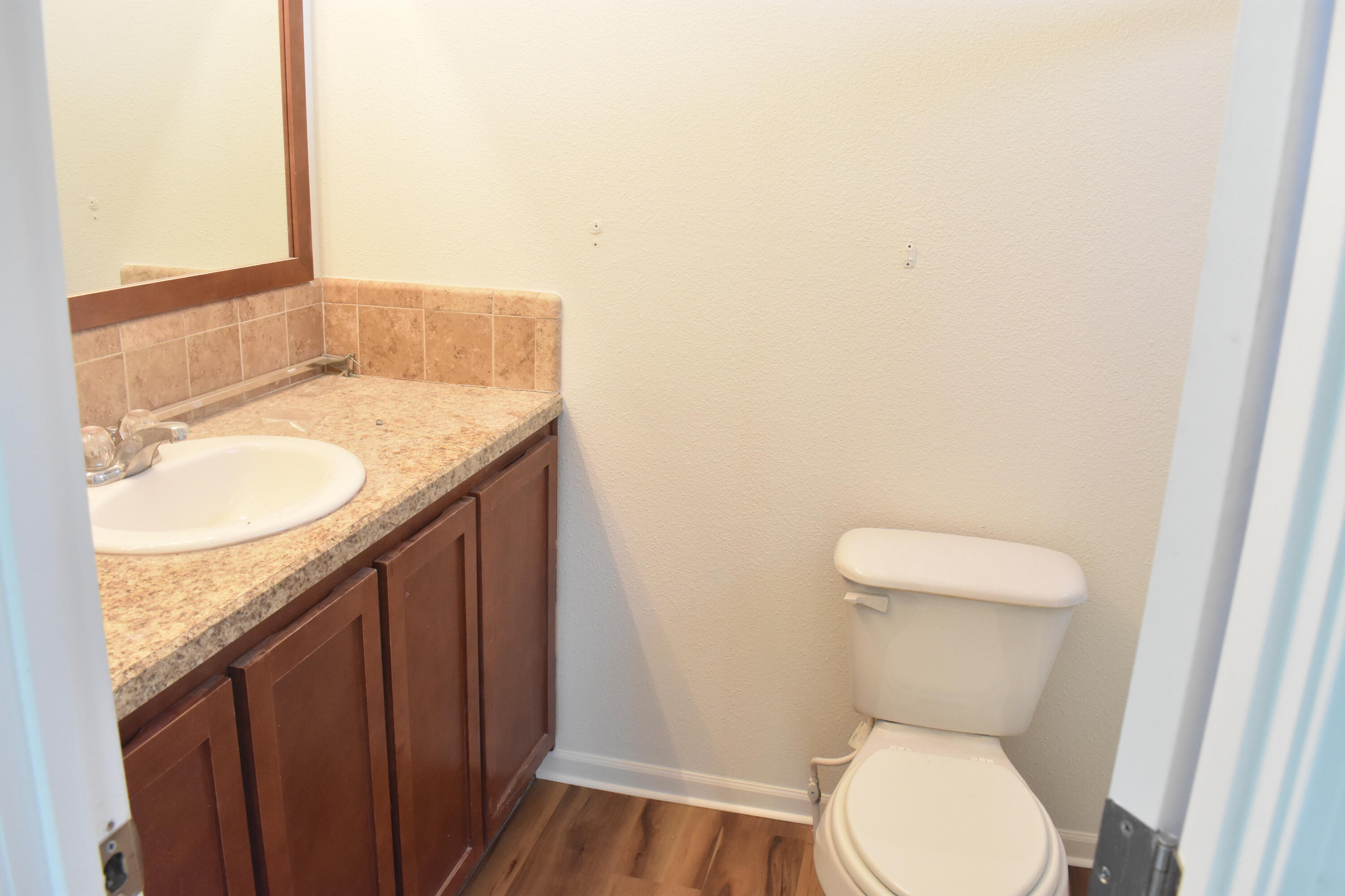 12125 Lake Boulevard Redding, CA 96003 - Photo 12 of 24 a bathroom with a granite countertop toilet and a sink