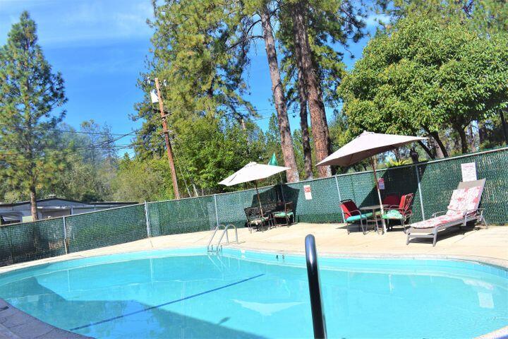 12125 Lake Boulevard Redding, CA 96003 - Photo 19 of 24 a view of outdoor space yard deck patio and swimming pool