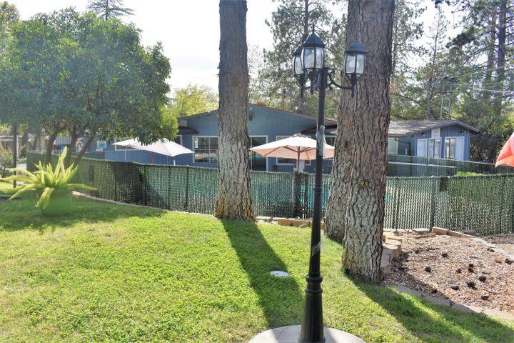 12125 Lake Boulevard Redding, CA 96003 - Photo 23 of 24 a view of a garden with a lake view