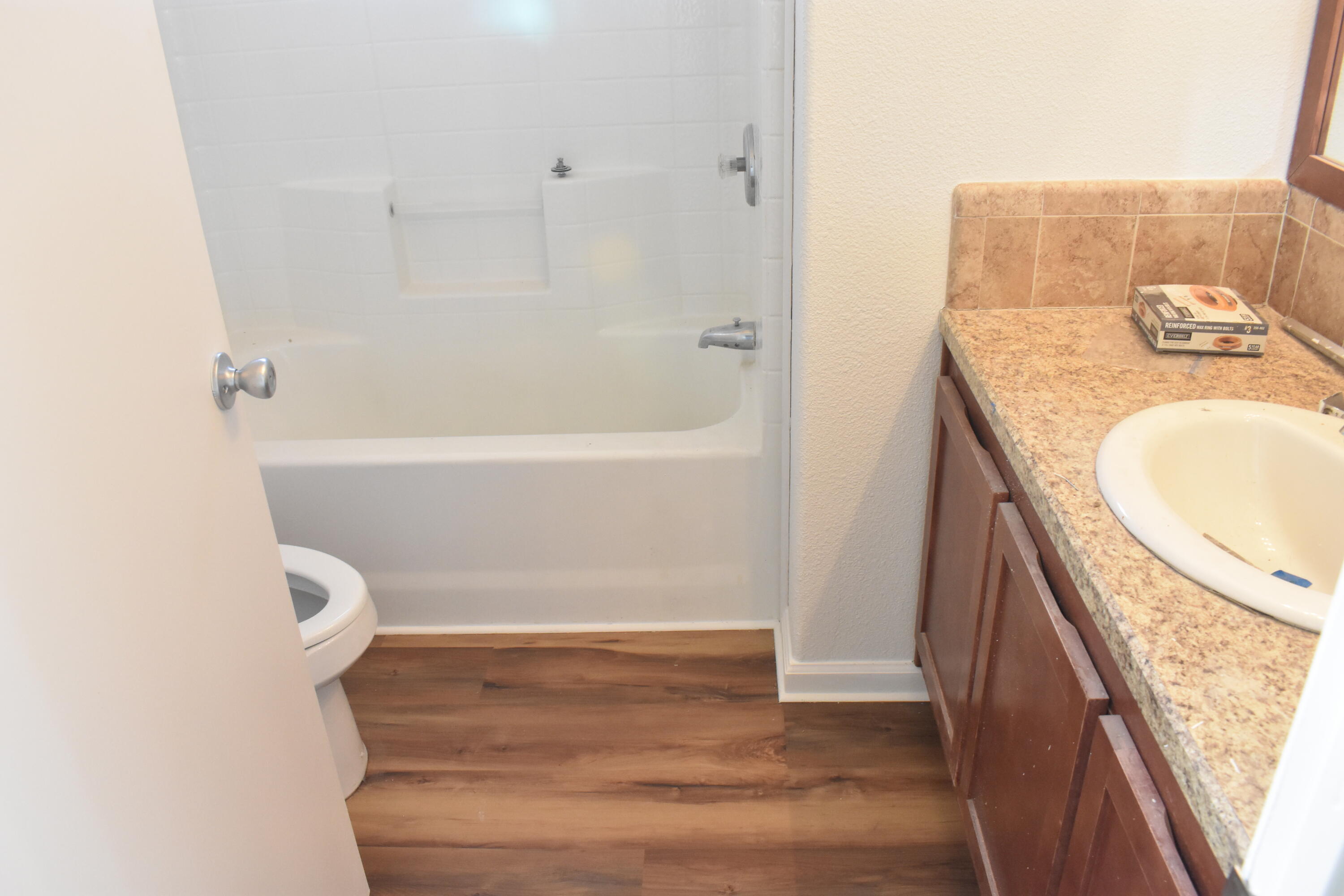 12125 Lake Boulevard Redding, CA 96003 - Photo 8 of 24 a bathroom with a granite countertop sink and a mirror