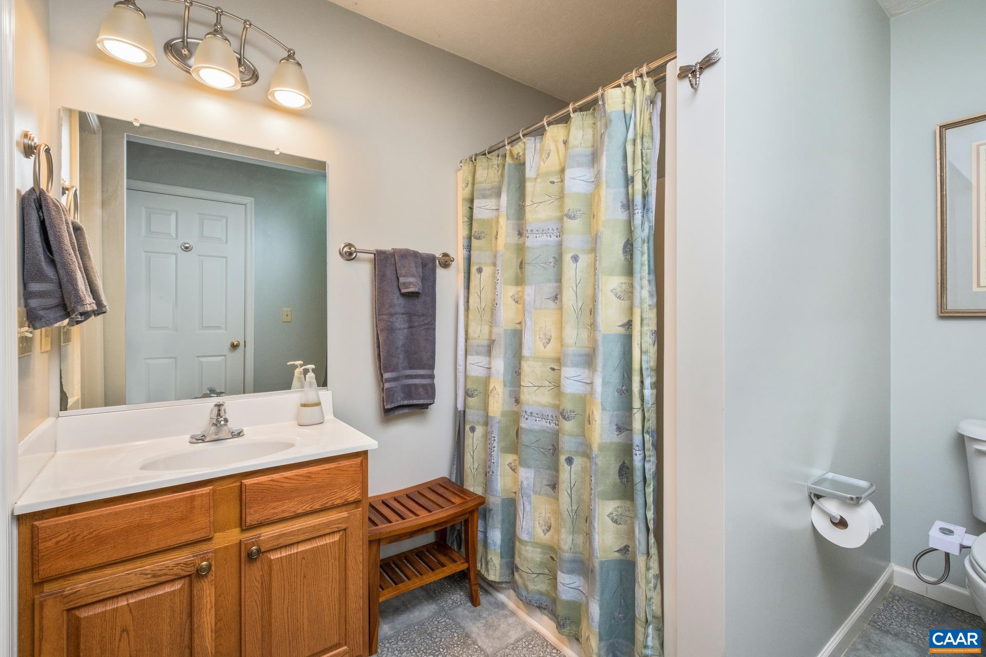 349 Todd Road Mount Sidney, VA 24467 - Photo 21 of 43 a bathroom with a double vanity sink toilet and shower