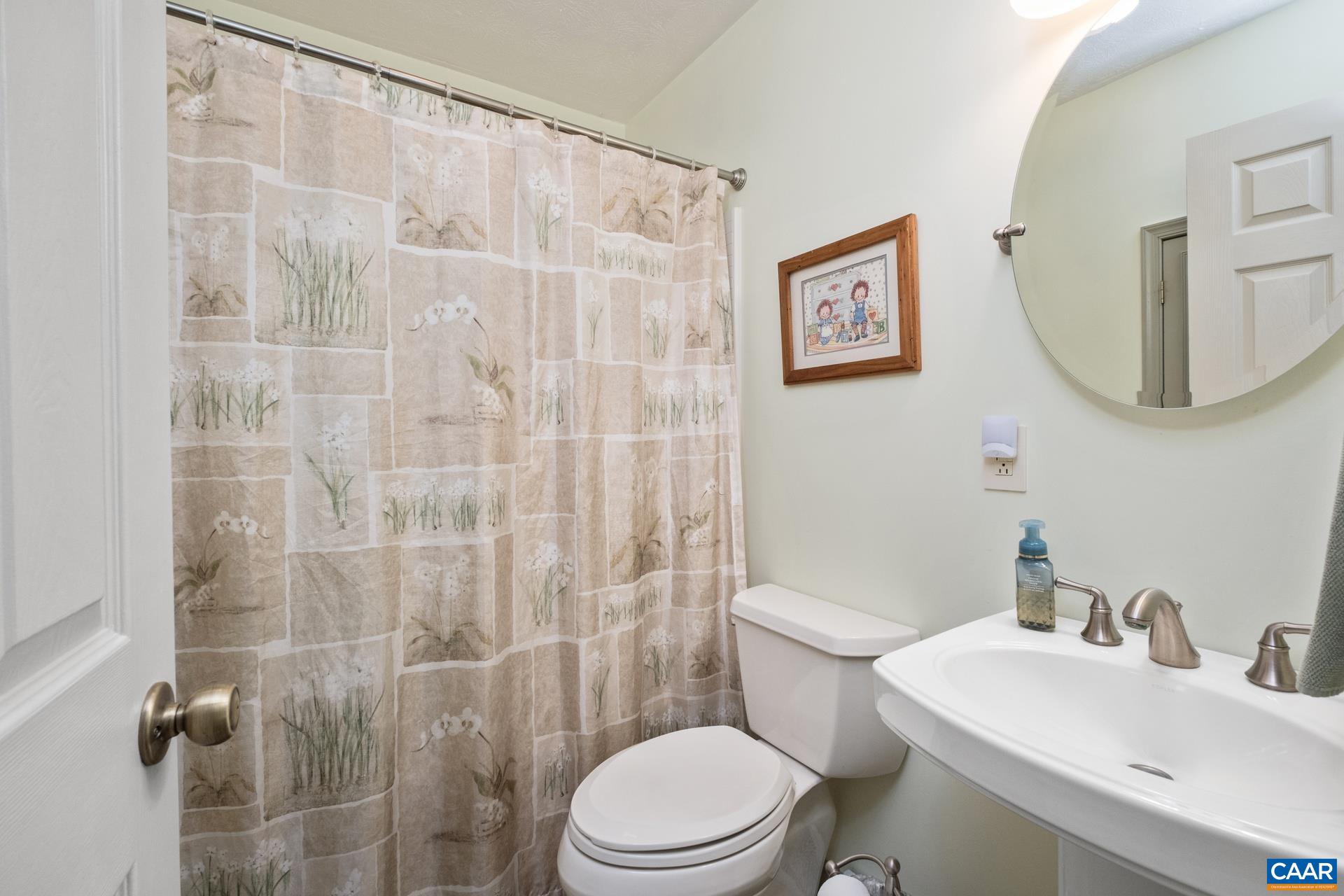 349 Todd Road Mount Sidney, VA 24467 - Photo 23 of 43 a bathroom with a sink mirror and a toilet