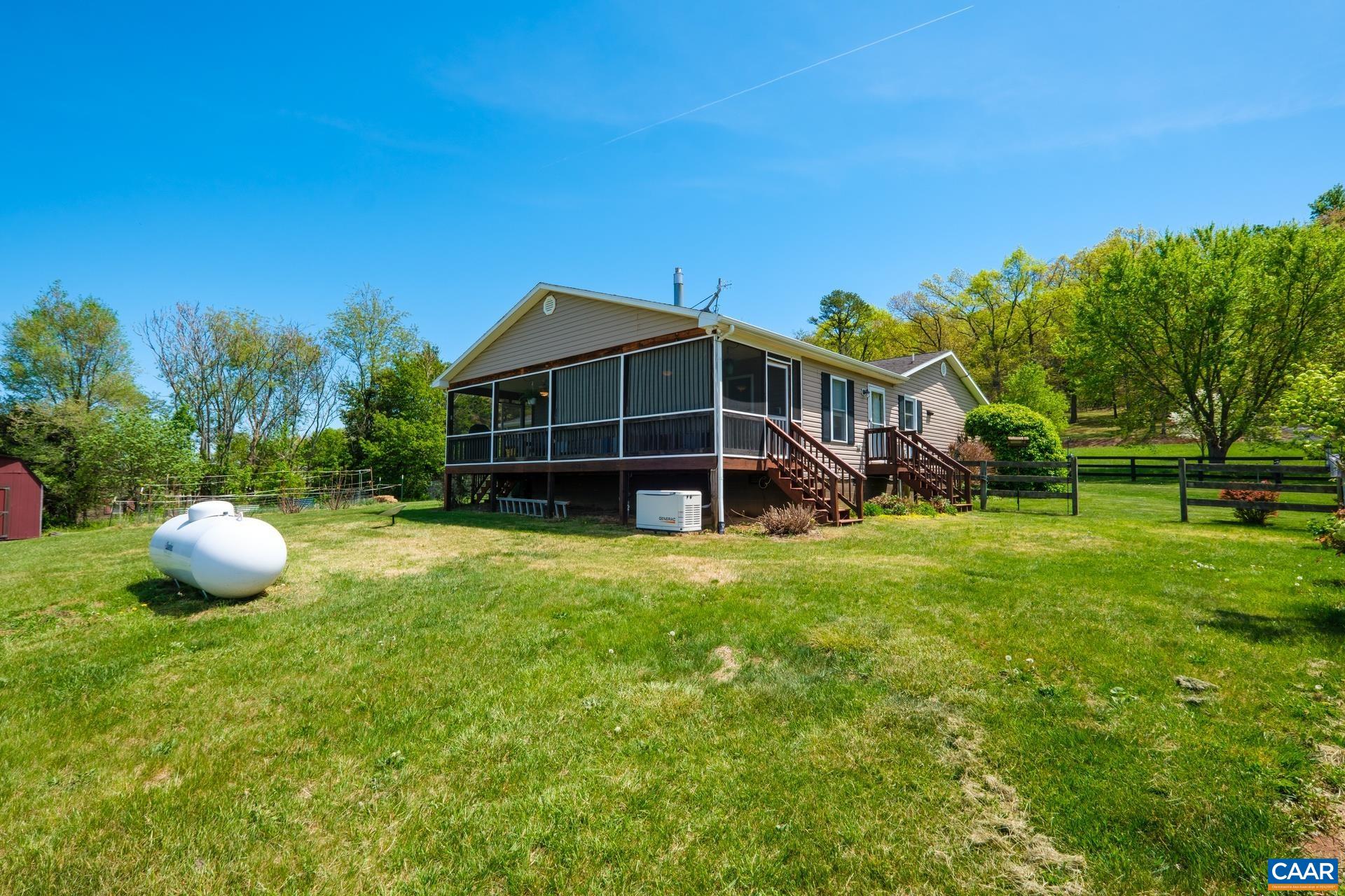 349 Todd Road Mount Sidney, VA 24467 - Photo 31 of 43 a view of a house with a backyard and a garden