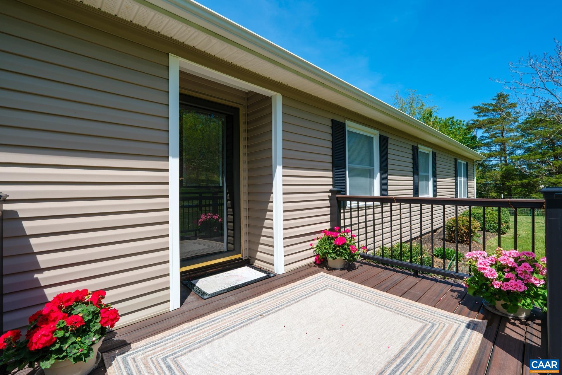 349 Todd Road Mount Sidney, VA 24467 - Photo 6 of 43 a view of a house with a flower in a garden