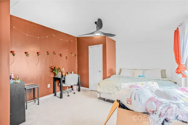 a bedroom with a bed and a table in it