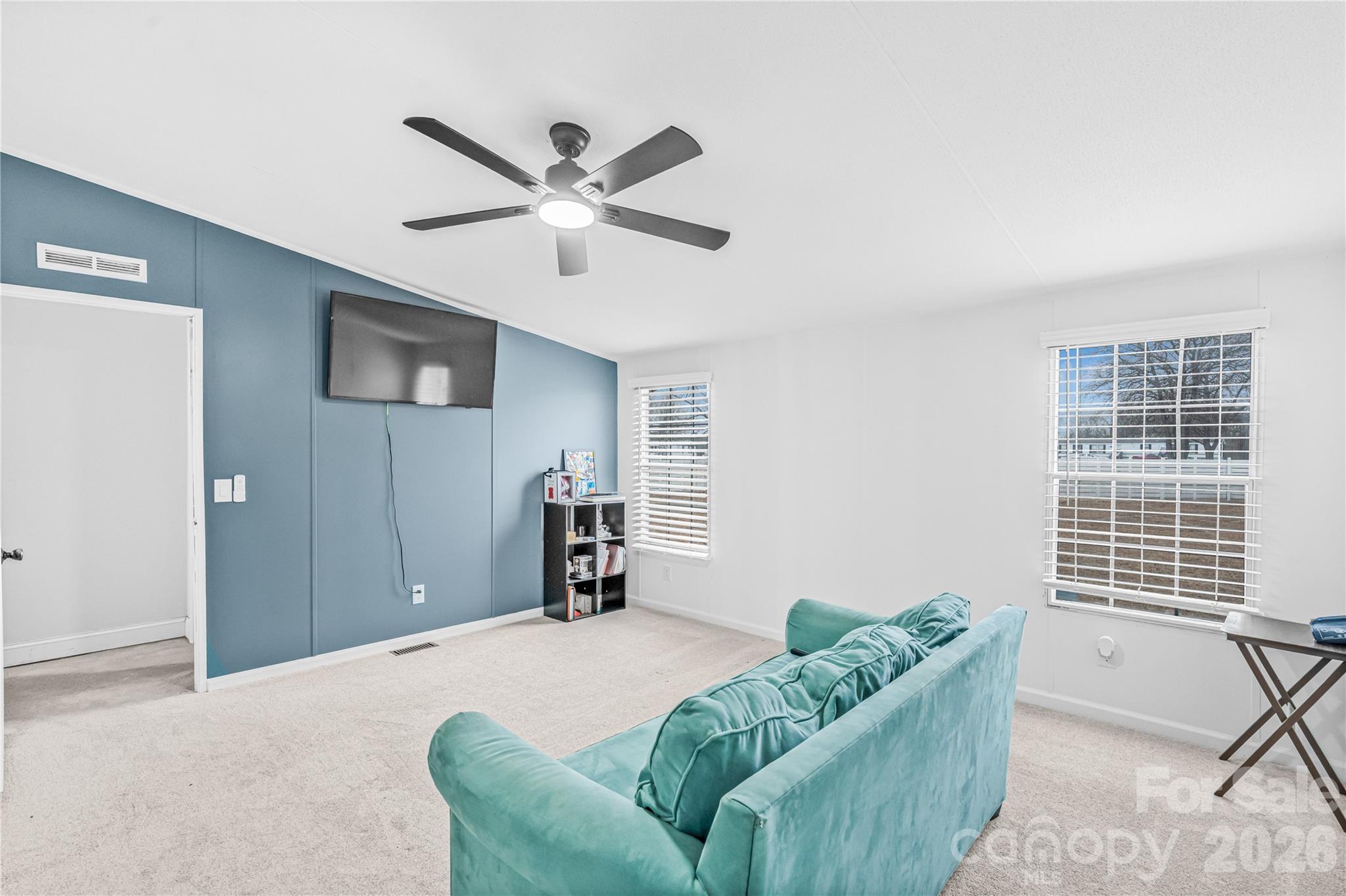 2235 Sandy Ridge Church Road Morven, NC 28119 - Photo 21 of 38 a bedroom with a bed and a couch
