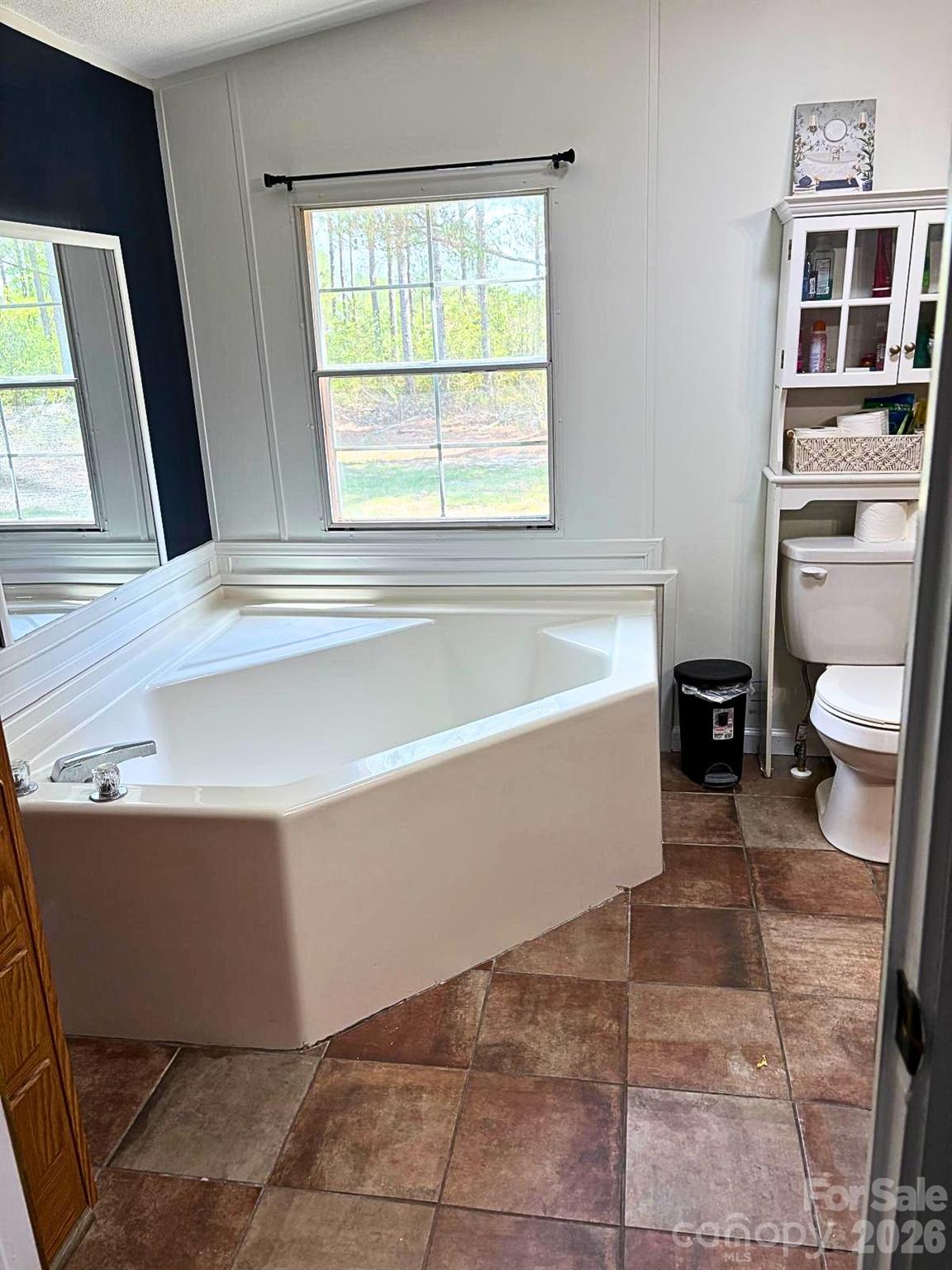 2235 Sandy Ridge Church Road Morven, NC 28119 - Photo 26 of 38 a bathroom with a bathtub and toilet