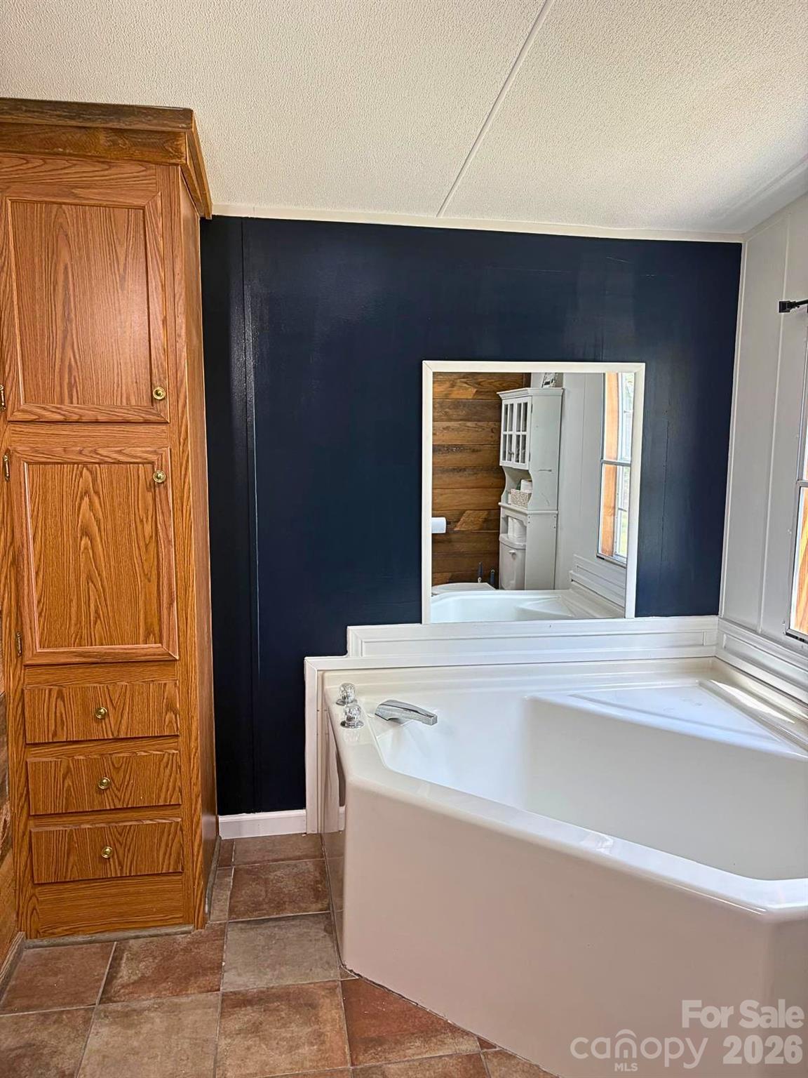 2235 Sandy Ridge Church Road Morven, NC 28119 - Photo 27 of 38 a view of kitchen with granite countertop cabinets and refrigerator