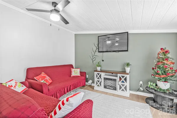 a living room with furniture and flowers