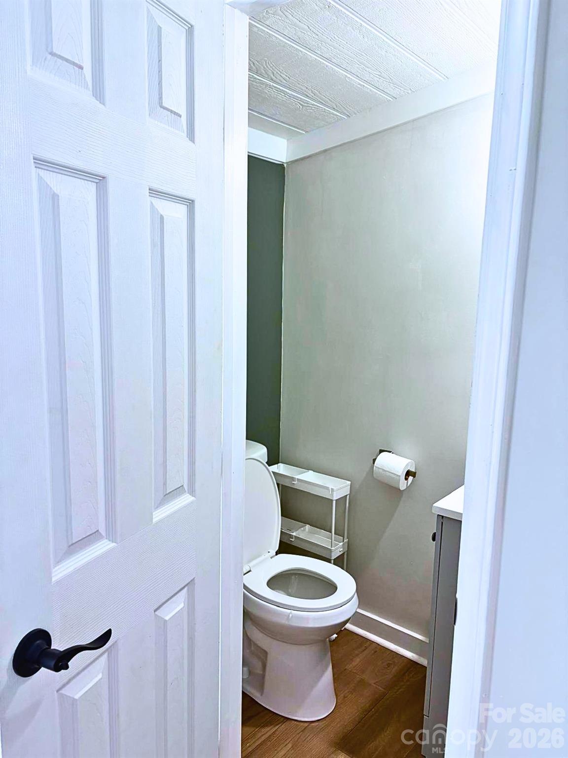 2235 Sandy Ridge Church Road Morven, NC 28119 - Photo 7 of 38 a white toilet sitting next to a small sink